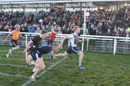 Ross Kirk winning fourth cross-tie from William Bates (blue bib) and Peter Denholm (black bib).