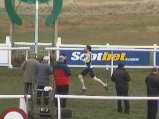 Craig Robertson winning the 1600 metres Open Handicap.