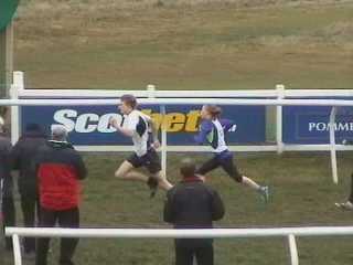 Dan Purves winning the 800 metres Youths Handicap from Kathryn Pennel.
