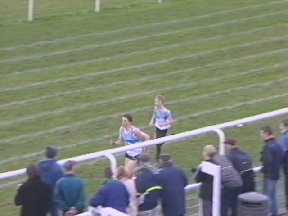 C. Robertson taking the lead from G. Gibson in the home straight of the 800m Youths.