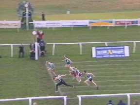 P. Swan (wearing black tights) pipping Stacy Brand in the 90m Youths.
